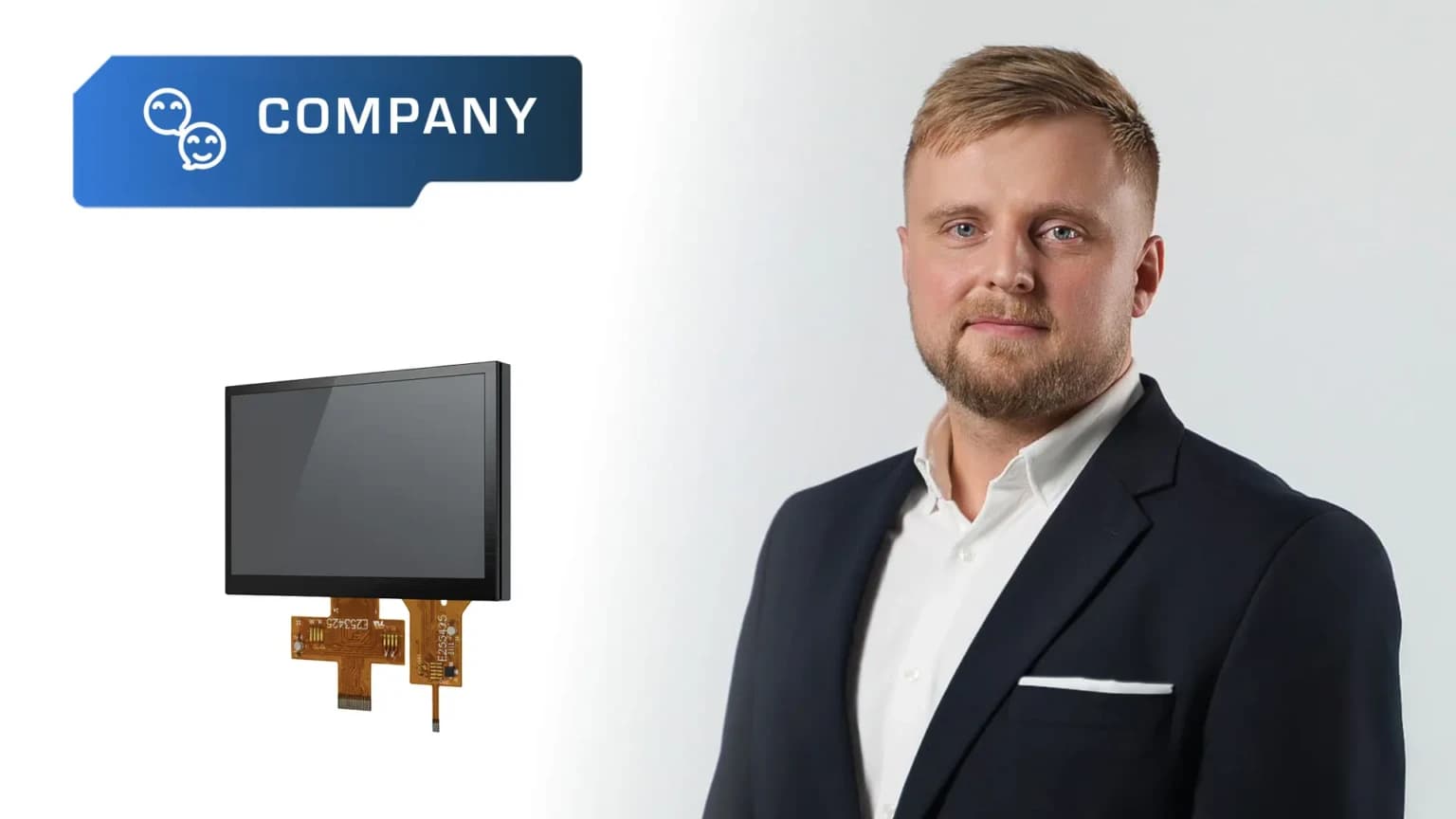 Unisystem - A man in a dark suit stands against a light background. To his left are a digital display with electronic components and a blue sign reading COMPANY, showcasing new products developed by Unisystem: industrial LCD-TFTs in three variants.